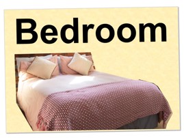 picture of a sign with the word bedroom and a bed